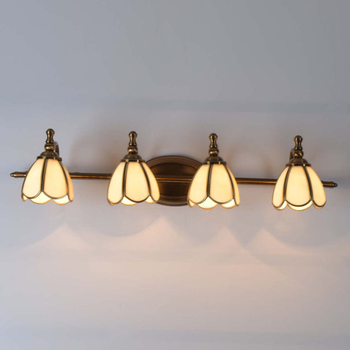 Avlon 4 lights mirror light in brass ant finish with frosted glass shades.