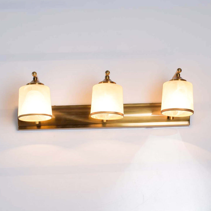 Arte brass antique finish triple lamps mirror light with frosted glass shades.