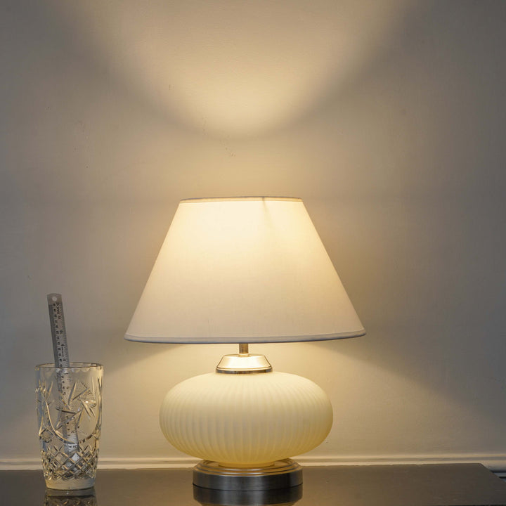 MALOTO Frosted White Glass and Chrome Finish Metal Table Lamp With Beige Cotton Shade
