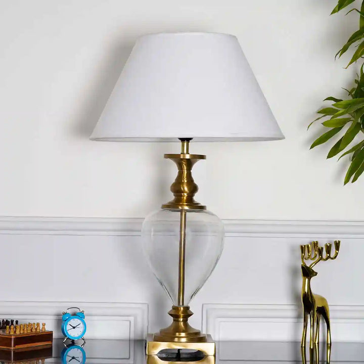 Hinton Clear Glass And Brass Finish Metal Table Lamp With Cotton White Shade