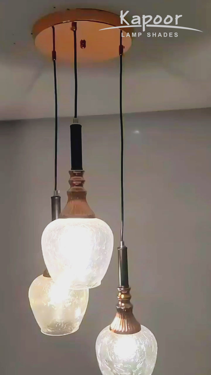 HIRST 3 Light Cascade Ceiling Pendant In Rose Gold And Black Finish Metal With Textured Clear Glass Shades